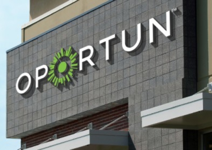 The Oportun logo on the large exterior sign on the company's headquarters.
