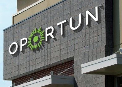 The Oportun logo on the large exterior sign on the company's headquarters.
