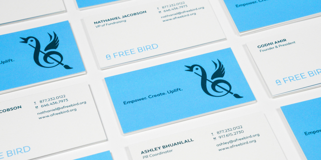 Fronts and backs of several business cards for the arts organization A Free Bird with the logo symbol and the text, Empower, create, uplift.