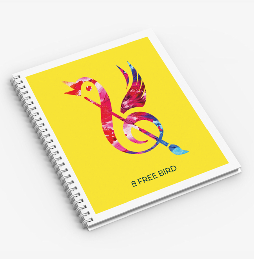 A promotional notebook for the arts organization A Free Bird, with the logotype and symbol on the cover.