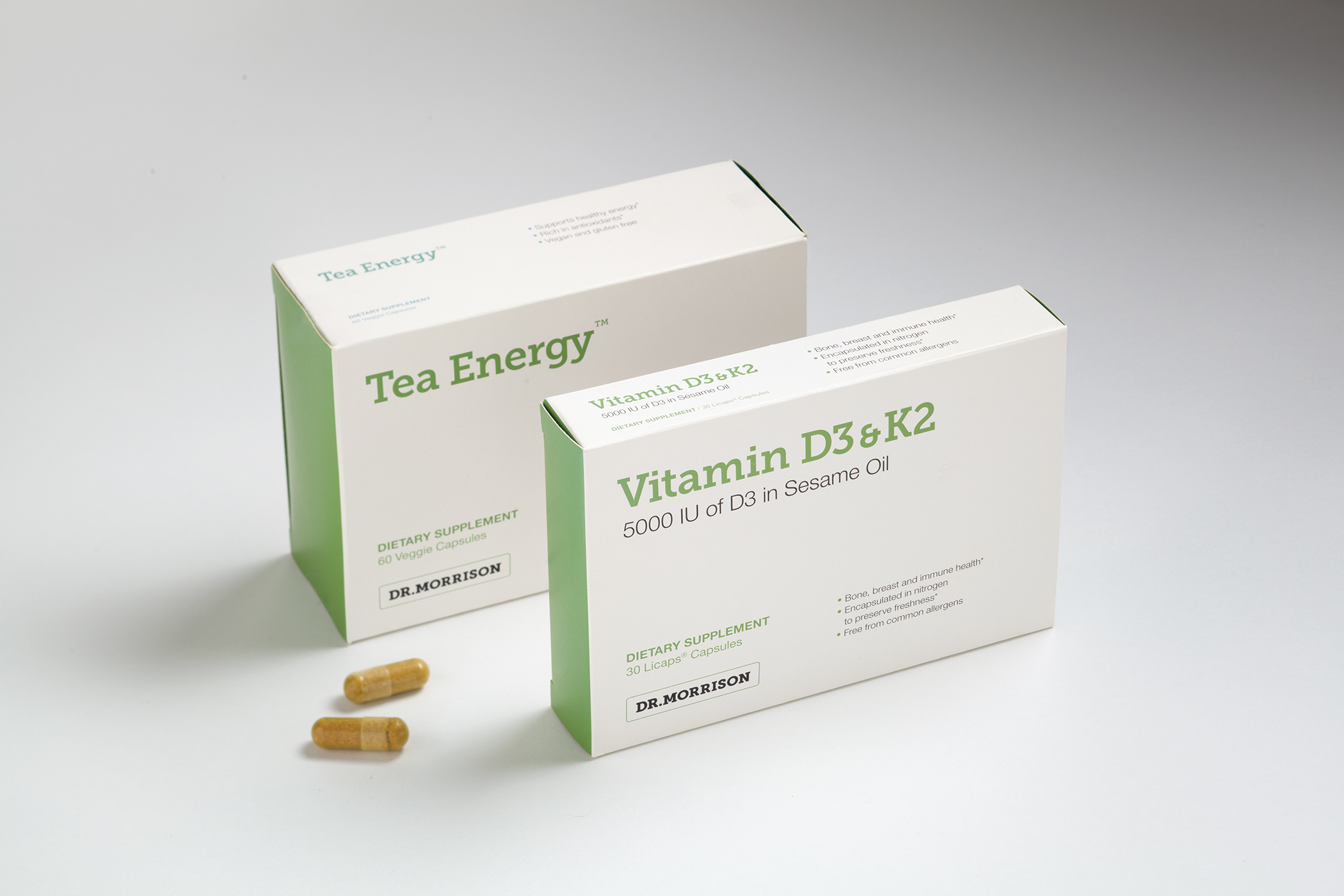 Dr. Morrison Tea Energy and Vitamin D3 and K2 packages and two individual capsules.