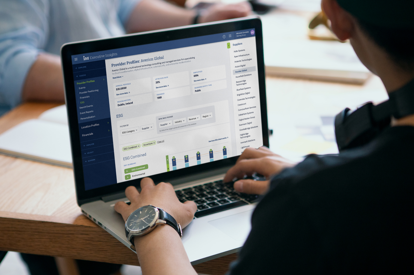Person using a laptop displaying Thinkso’s UX/UI redesign of the ISG Executive Insights enterprise technology platform.