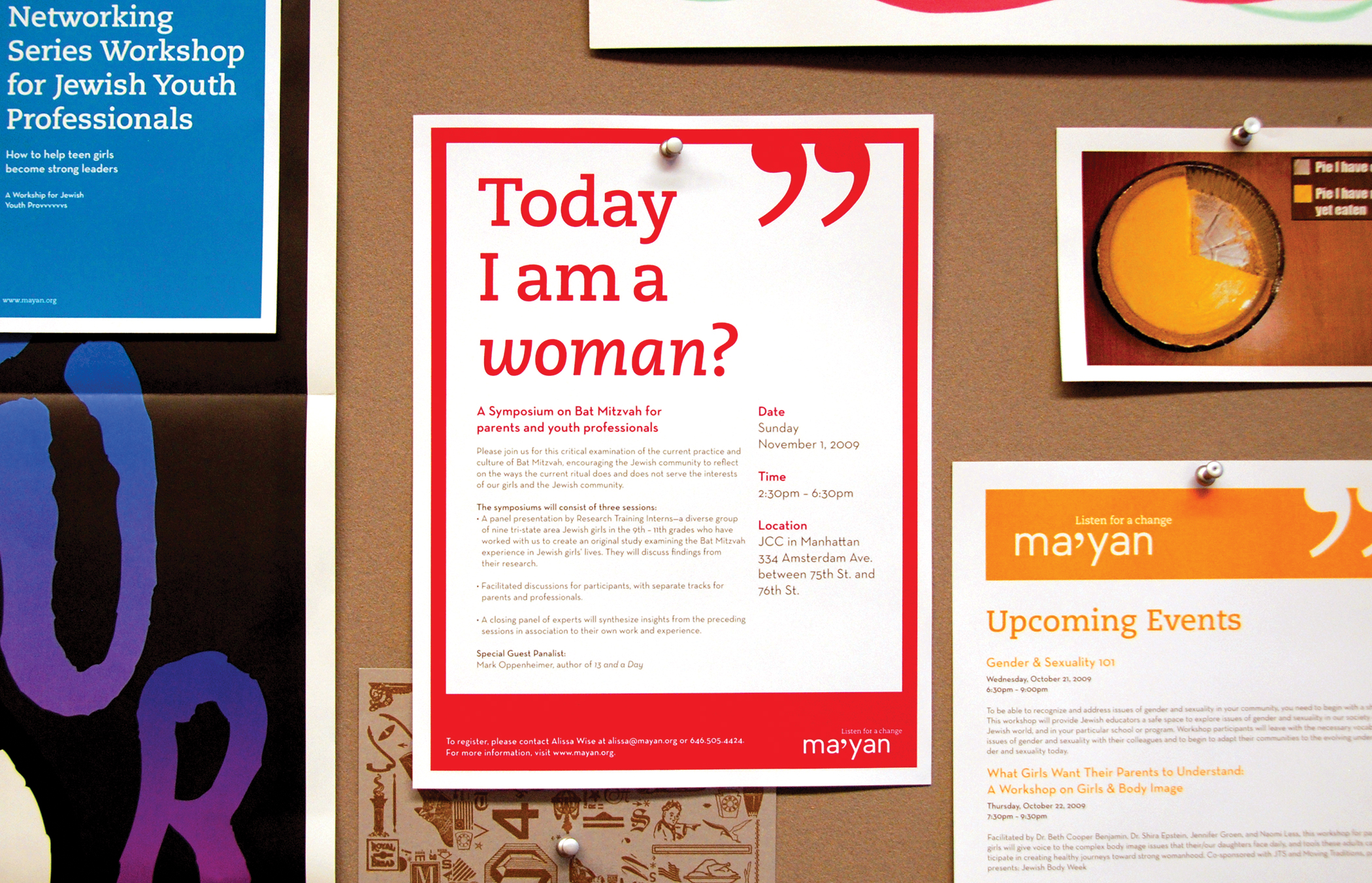 Several Ma'yan promotional posters in a wall; one in the center reads, Today, I am a woman.