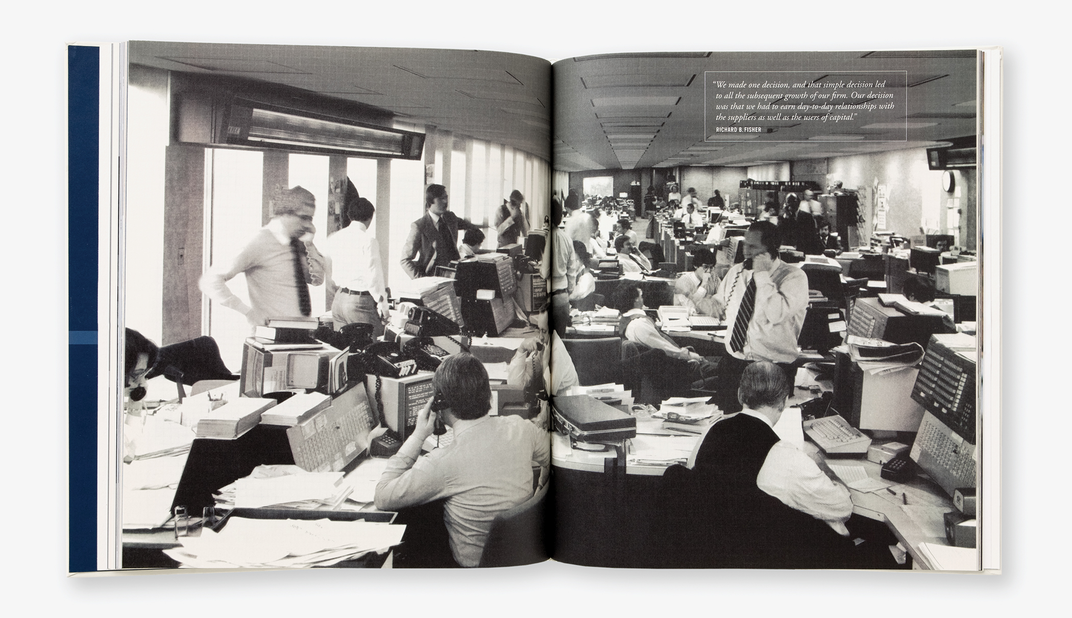 Pages from the Morgan Stanley 75th anniversary commemorative book showing a wide view of a crowded trading room.