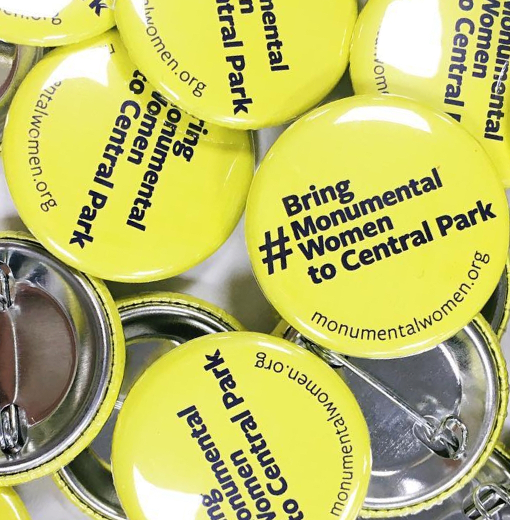 Bright yellow buttons with the text Bring Monumental Women to Central Park