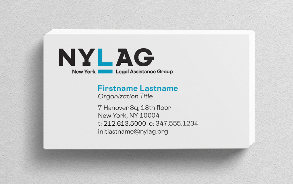 A stack of white business cards showing New York Legal Assistance Group logo and employee contact information.