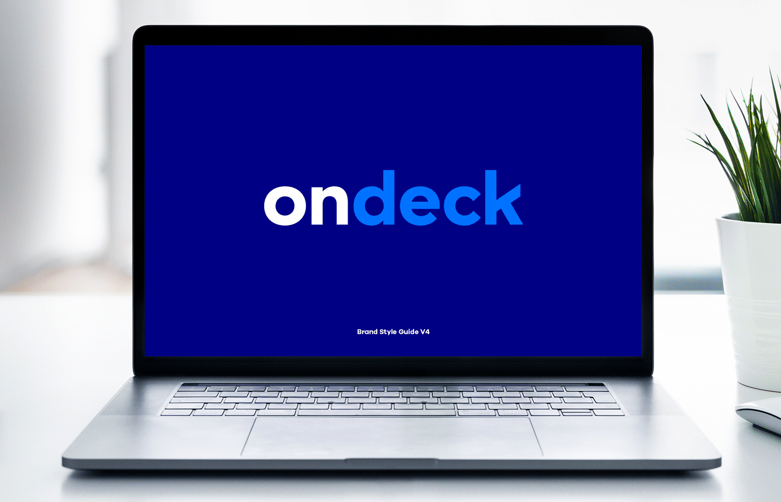 A slideshow of pages from the OnDeck brand guidelines shown on a laptop computer, including editorial and visual elements.