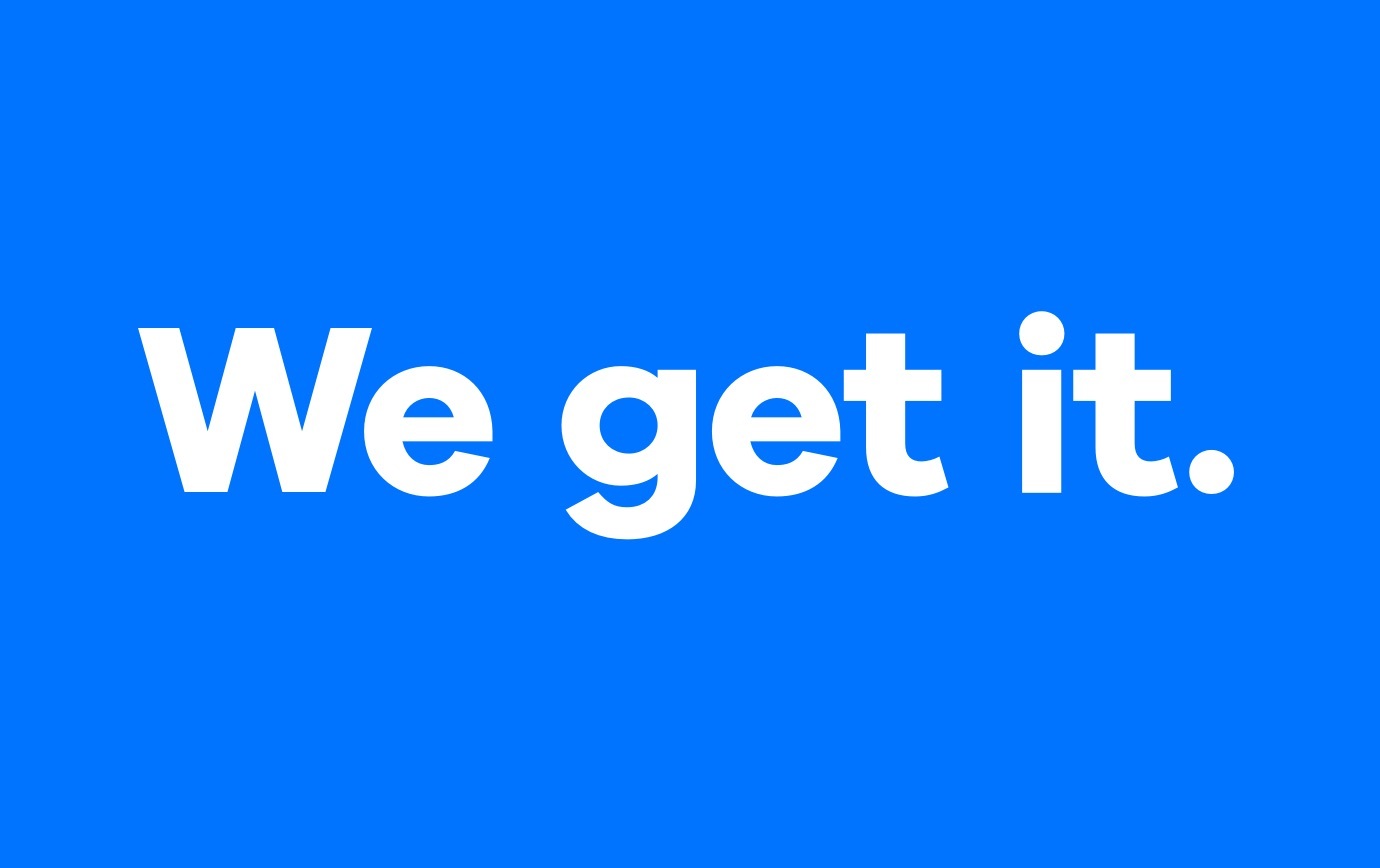 The phrase “We get it” in bold white letters on a blue background.