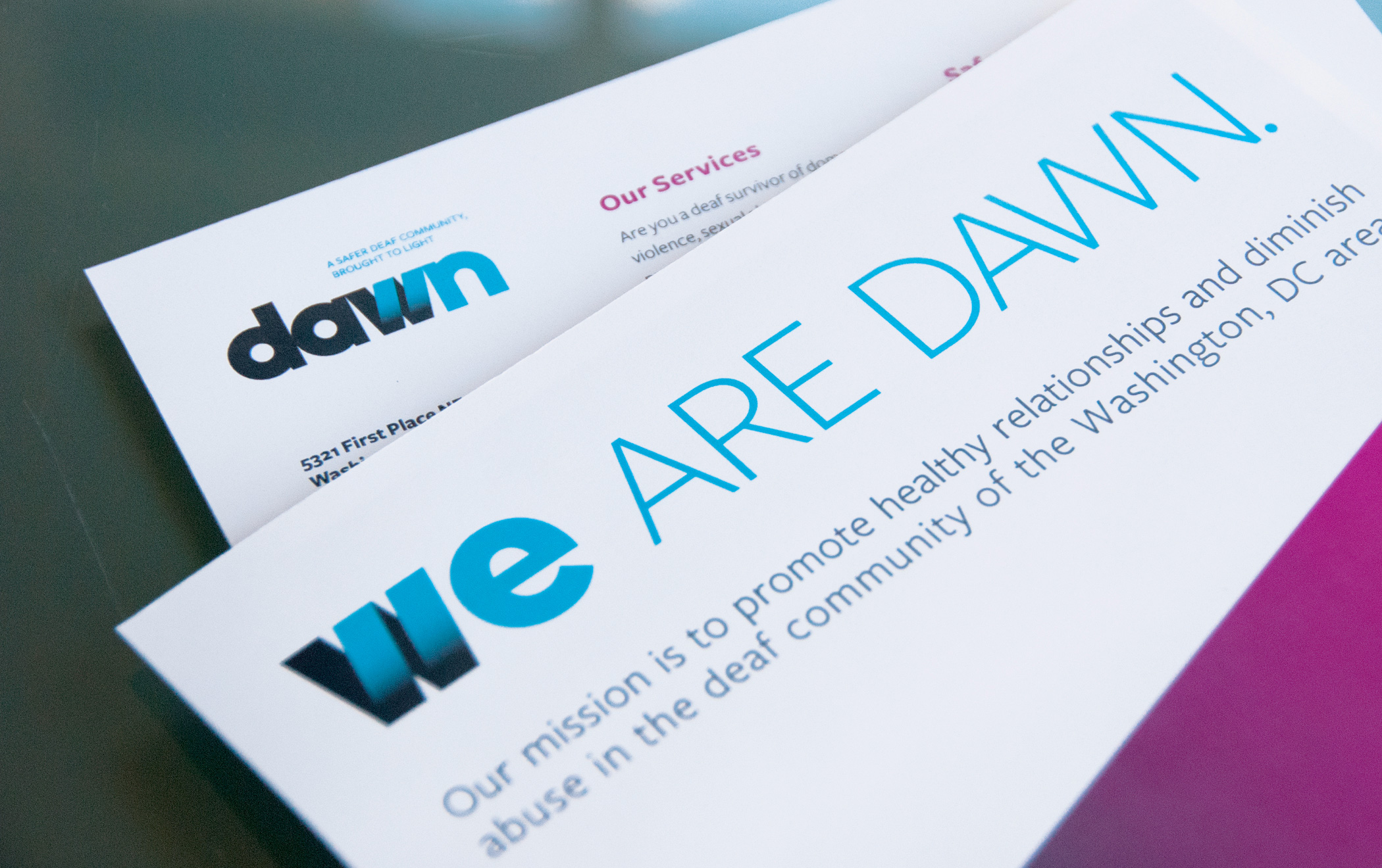 A postcard for the deaf advocacy group Dawn with the headline text, We are Dawn.