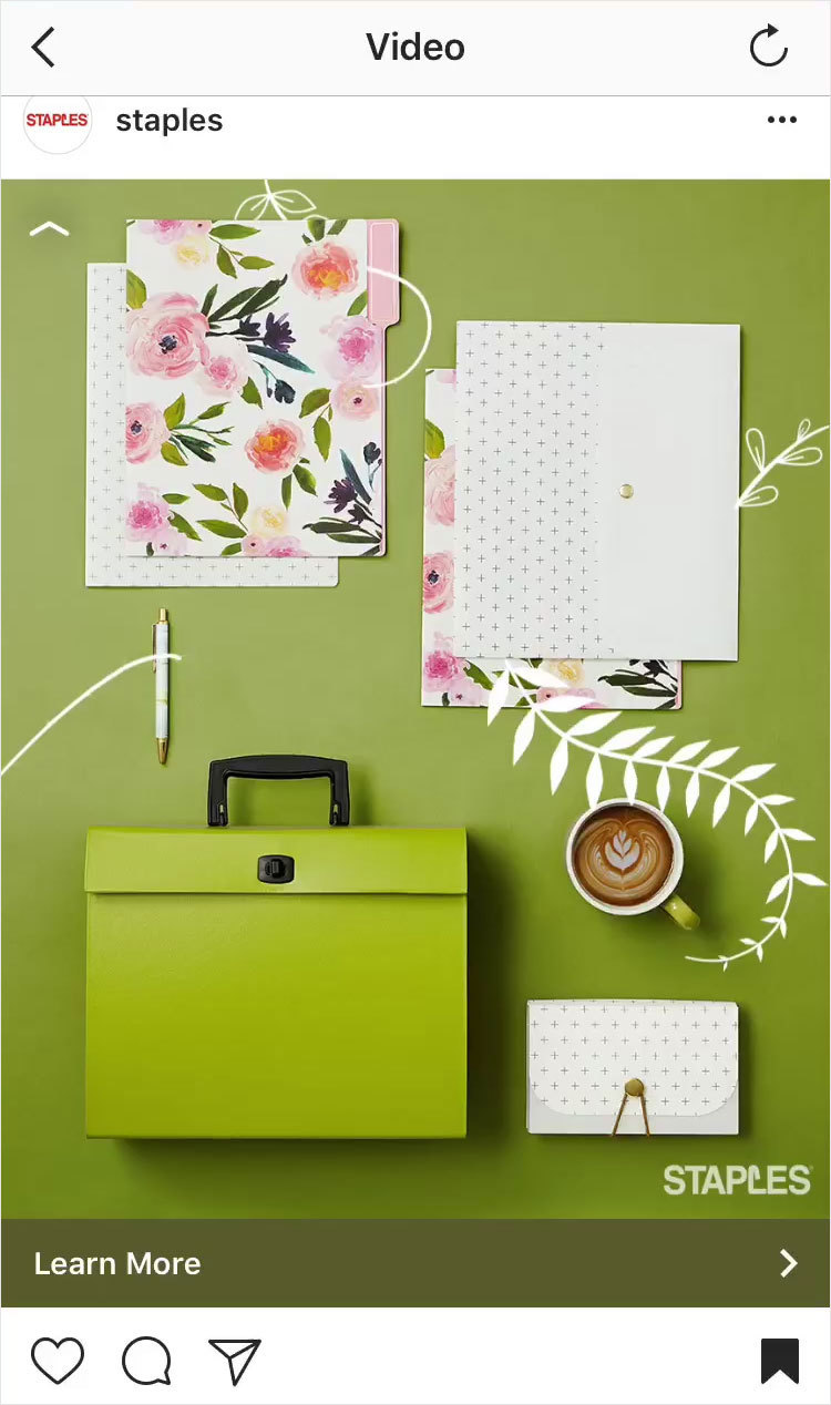 Promoted Instagram post by Staples of floral stationary arranged on a green background. 