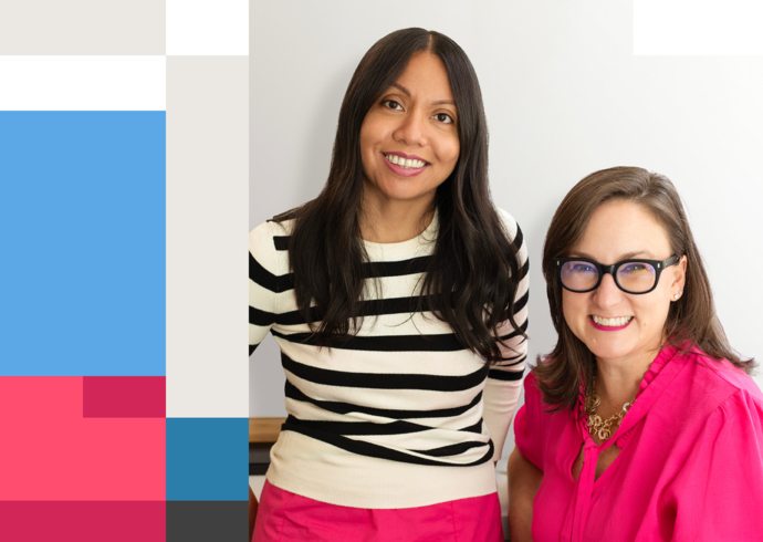 Shelley, a South Asian woman wearing a striped shirt, and Elizabeth, a white woman wearing a pink shirt, smiling together.