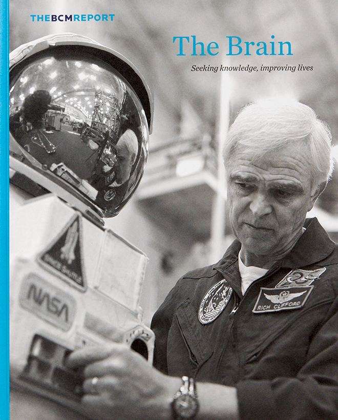 Cover of Baylor College of Medicine BCM report, featuring a NASA scientist working on a space suit.