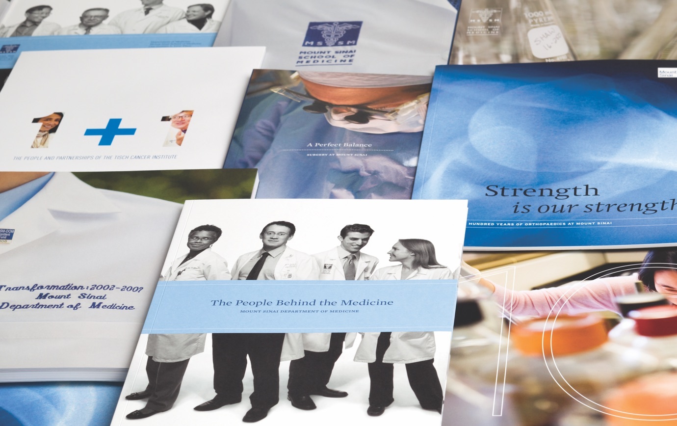 A table full of Mount Sinai Medical Center brochures. with images of doctors and titles like, the people behind the medicine.
